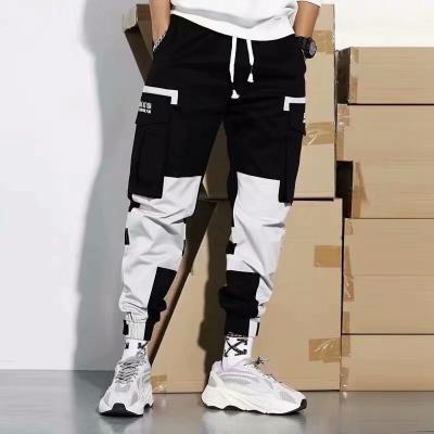 China Anti-Wrinkle Cargo Pants Wholesale 2021 Black Multi Pockets Trotter Pants Loose Hip Hop Sports Workout Pants Men Casual Male Sweatpants for sale