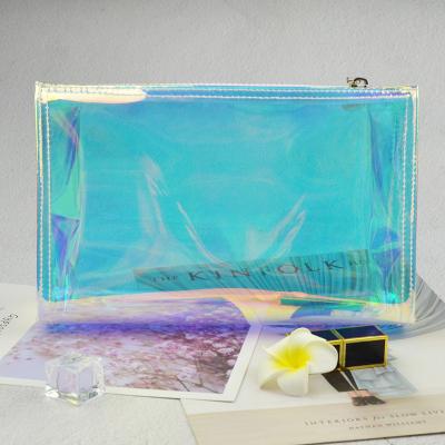 China Lady High-quality Cosmetic Bag TPU Laser Magic Transparent Color Travel Cosmetic Storage Bag Wash Bag for sale