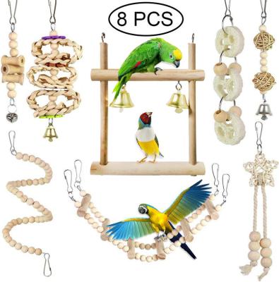 China Stocked 8 Pcs Natural Wooden Bird Parrot Swing Toys Bell Bird Hanging Toys For Small Parakeets Cockatiels for sale