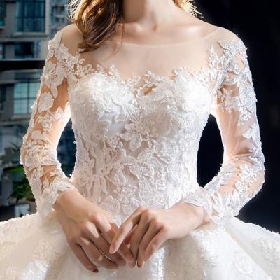 China Custom Embroidered Layered Wedding Dresses Bridal Gowns Women Wedding Dress Long Sleeve Pom Pom Skirt Dry Cleaning For Women for sale