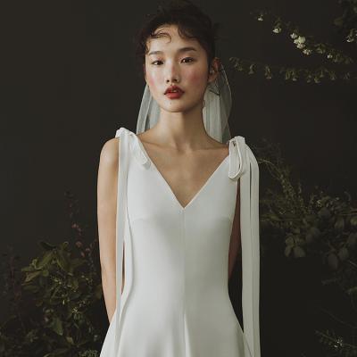 China Custom Made Simple Elegant Wedding Dress Dry Cleaning Line Soft Satin Girl Wedding Dress Bow Wedding Dresses for sale