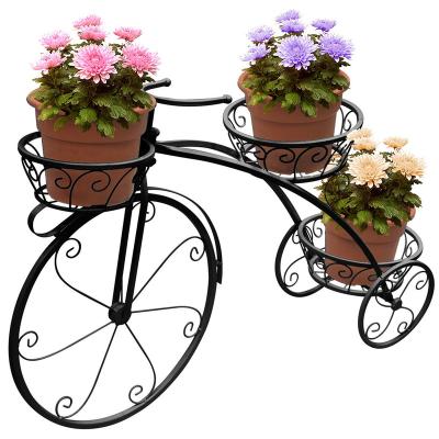 China Viable Creative Bicycle Styling Nordic Flowerpot Rack Floor Metal Flower Rack Bicycle Wrought Iron Plant Style Outdoor Rack for sale