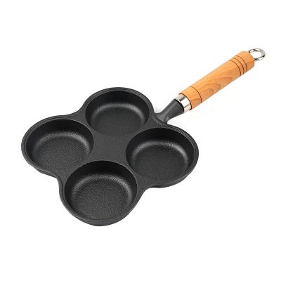 China Quality Assurance Cast Iron Lace Four-hole Omelet Stocked Pan Household Cooking Tools for sale