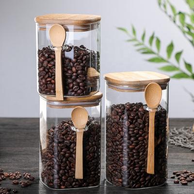 China Viable Square Storage Jar Glass Sealed Seasoning Box With Wooden Spoon Coffee Bean Storage Jar Kitchen Supplies Box for sale