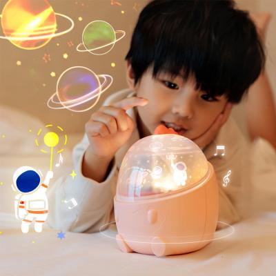 China Modern Creative Projector Light Best Gift Decoration Kids Sleep Coaxial Galaxy Dinosaur USB Music Box Silicone Rechargeable Night Light for sale