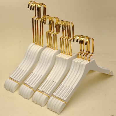 China Hot Selling Anti-skid Popular Wooden Clothes Hangers And Brass Baby Clothes Hangers Wooden Craft for sale