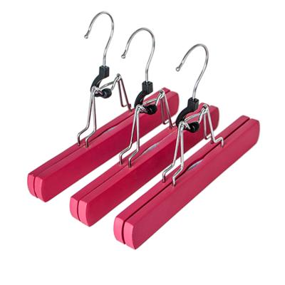 China Multifunctional Pink Flocking Luxury Wooden Brand Hanger Coat Hanger For Pants for sale