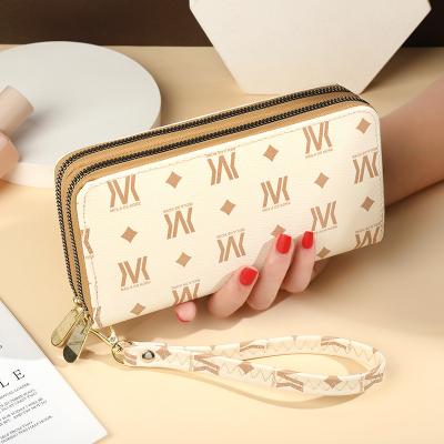 China New fashion large capacity double zipper waterproof European and American women wholesale printing clutch bag for sale