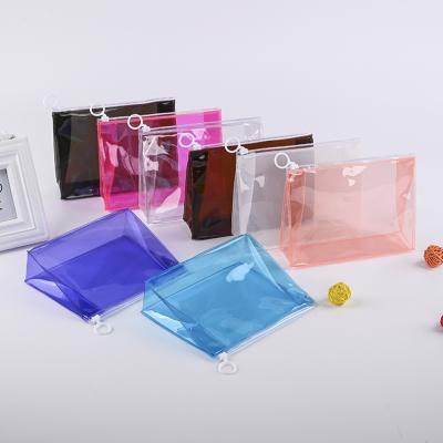 China Durable Custom PVC Stain Clear Zipper Bag Plastic Travel Wash Storage Cosmetic Bag for sale