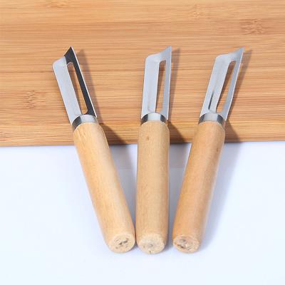 China Sustainable Vegetable Fruit Peeler Slicer Knife Stainless Steel Handle Wooden Slicer Cooking Tools for sale