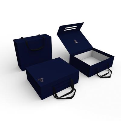 China Custom Luxury Recycled Materials Flapper Apparel Paper Box Flip Top Gift Boxes With Black Ribbon Closure Handle for sale