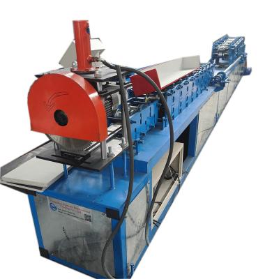 China Construction worksÂ   0.4-1 mm Galvanized Economical Option Fly Saw Cutting Semi Automatic Roll Shutter Door Slat Channel Roll Forming Machine for sale