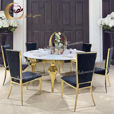 China Sumptuous metal fishtail legs design contemporary gold dining table sets for sale