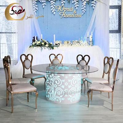 China Remote control led light wedding furniture glass top metal base dining table for sale