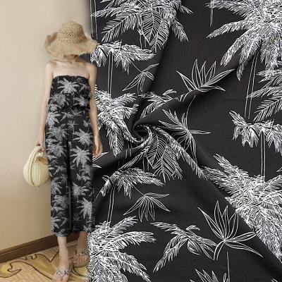 China 2020 Hot Sale Black Coconut Tree Sustainable Pattern Woven Crepe Dress Fabric Printed Spun Rayon for sale