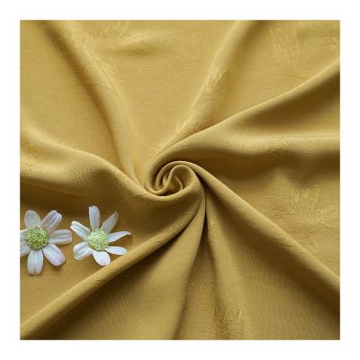 China Hot Sale Anti-Static Plain Dyed Rayon Magnolia Flower Jacquard Fabric Woven Yellow Floral Yellow for sale