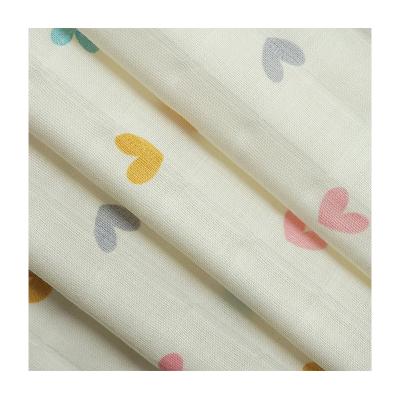 China New design heart pattern jacquard style muslin comfortable baby print fabric anti-static for clothes for sale