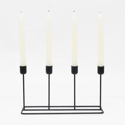 China Luxury 4 heads black metal pole candle stand church wedding table discount wholesale custom candle holder for sale