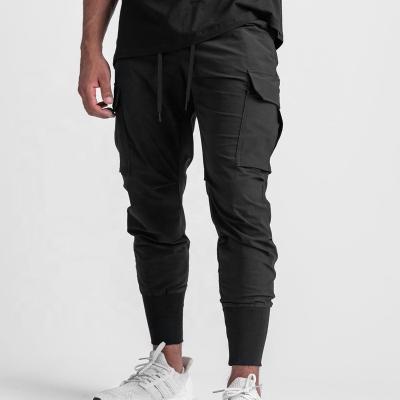 China Breathable Streetwear Zipper Mens Pants Pocket Strap Joggers Mens Pants Cargo Pants Male Overall for sale