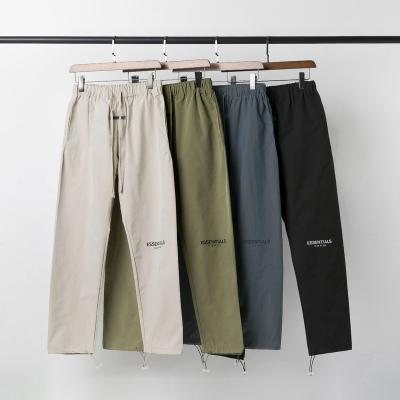 China 2022 New Anti-wrinkle Collection Fear Of God Bases Fog Logo Reflective Printed Loose Waist Nylon Pants Sweatpants Drawstrings Low for sale