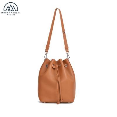 China Other Classic Cowhide Leather Drawstring Bucket Bag Women Bag With Single Detachable Leather Strap for sale