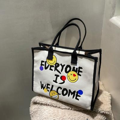 China New fashion custom South Korea Central Statistical Institute of Statistics large capacity smiley multifunctional lightweight fashion portable tote bag with zipper for sale