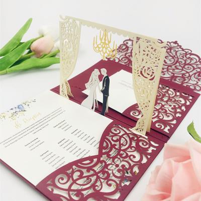 China Europe Gift Wedding Card Designs Pakistan Aegean Luxury Arch Folded Laser Cut Wedding Invitation Card Gold for sale