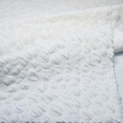 China Stretch Polyester Textured White Knitted Cotton Seersucker Ply Fabrics Swimwear Bikini Fabric for sale