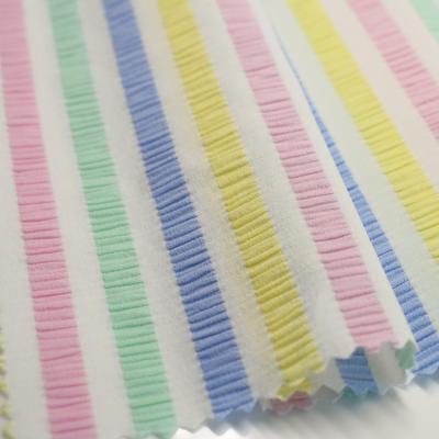 China Popular Woven Colorful Stretched Stretch Stripe Pleat Jacquard Fabric Swimwear Fabric Supplier for sale