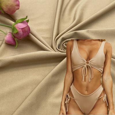 China Wicking lightweight nylon weft knitted shiny underwear fabric mold cup tarpaulin comfortable swimsuit bikini fabric for sale