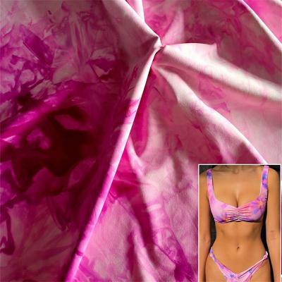 China Wicking Tie Dyed Waxy Nylon Spandex Warp Knitted Elastic Yoga Swimsuit Fabric for sale