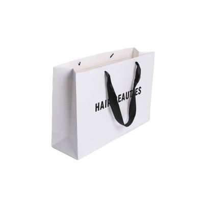 China Ribbon Handle Ivory Board Paper Bags With Custom Logo For Handmade Clothing Packaging for sale