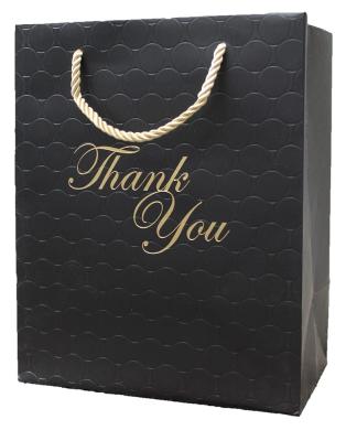 China Bolsas de papel de lujo personalizadas negras para compras de regalo embalaje de joyas ropa boutique en venta