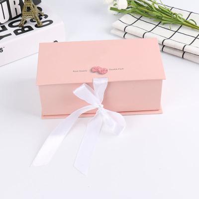 China Gift Craft Pink Paper Box with Ribbon and Folding Lid Custom Shape Logo Packaging Box for sale