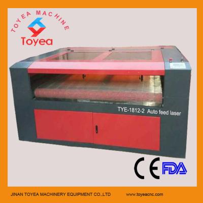 China Double heads Auto feeding laser engraving&cutting machine machine for cloth,leather TYE-1812-2 for sale