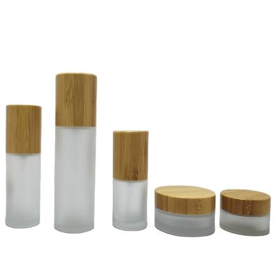 China High Quality Cosmetic Bamboo Skin Care Cream Packaging With Cap Glass Skin Care Cream Bamboo Jar With Wooden Lid for sale