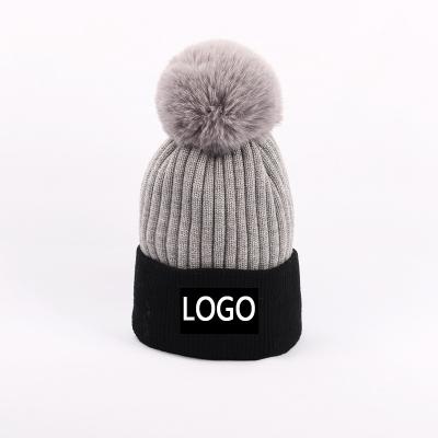 China Custom Kids COMMON Pom Pom Plain Beanie Toque Logo Hat Adults Plush Lining Winter Knitted for sale