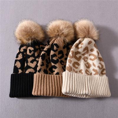 China Stylish Students Knitted Acrylic Pom Pom Beanies For Women High Quality Ladies Leopard Print Winter Hat COMMON for sale