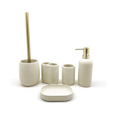 China Sustainable High Quality Polyresin Soap Dispenser Sand Stone Look 5 Pieces Bathroom Shower Sets for sale