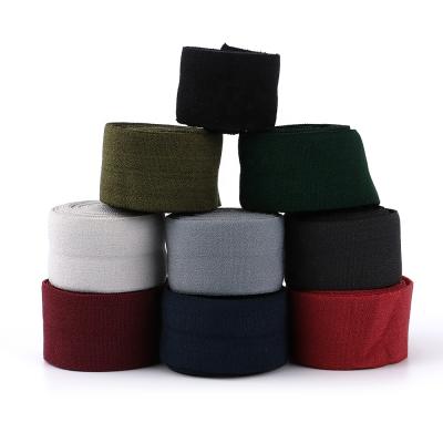 China Wholesale Solid Color Elastic Soft Fold Over Elastic Band In Elastic Half Webbing No Latex Rubber Yarn For Garment Baby Clothes for sale