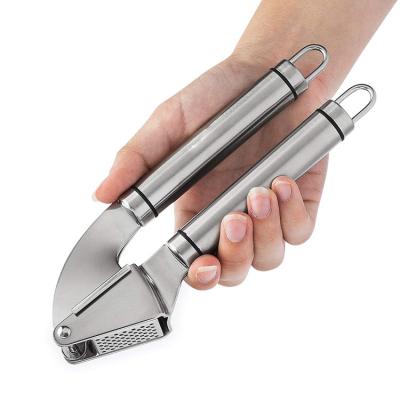 China Amazon Stainless Steel Garlic Press Kitchen Instrument Garlic Press Tool Kitchen Accessories Hot Selling Viable Garlic Press Cleaver for sale