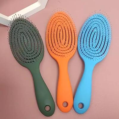 China Custom Logo Plastic Scalp Massager Vented Curly Quick Dry Oval Hollow Out Detangling Custom Hair Brush for sale