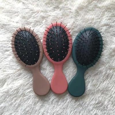 China Colorful Customized Massage Mini Size Oval Cushion Detangling Kids Hair Brush for sale