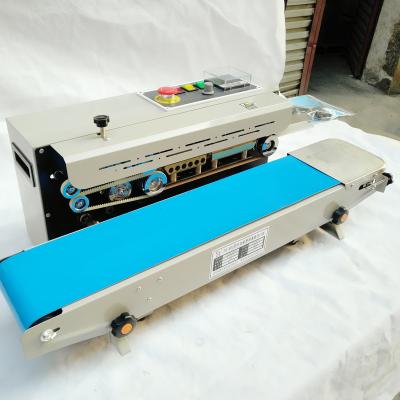 China FR900 Automatic Beverage Plastic Pouches Heat Sealing Machine Plastic Pouch Continuous Strip Sealer Sealing Machine For Commodity for sale