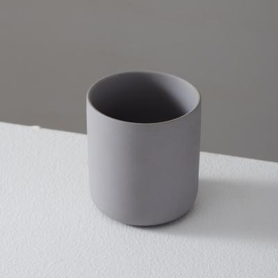 China hot sale color clay cylinder mini cute porcelain container ceramic candle jar for candle making for sale