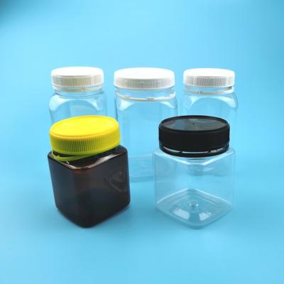 China Amber Bottle Square Child Proof 400ml Plastic Candy Jars for sale