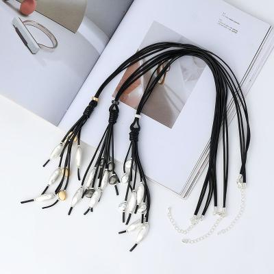 China Add UV-coating on Surfuce product to prevent tarnish Matt Finish Hammered Hollow Alloy Pearl Long Black Leather Tassel Sweater Necklace for Women Party for sale