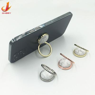 China Adjustable Crystallize Howlite Metal Metall Kickstand Bracket Foldable Mobile Phone Ring Holder for sale