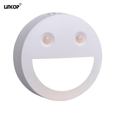 Cina Faccia sorridente Induzione intelligente Luce notturna LED Suczione magnetica wireless in vendita