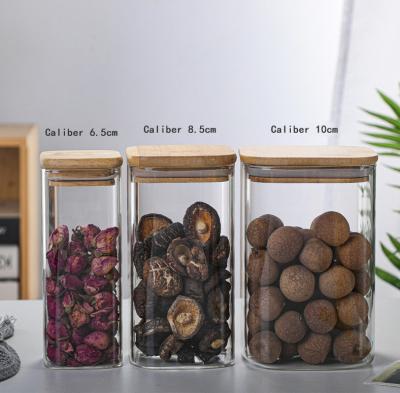 China Freshness preservation glass storage jar with metal seal lids/heat resistant glass jar/glass containers with airtight bamboo lids for sale